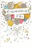 This congratulations card presents a scene of joyful elegance, as if someone in Paddington had gathered a festive bundle of balloons and captured it in ink and glitter. At the card's centre, a bouquet-like cluster of balloons floats upward, overlapping and nestling together. The colours are soft yet celebratory: muted gold and silver sit alongside pale champagne, sky blue, blush pink, and gentle grey, blending to create a sophisticated, pastel-toned display. Each balloon boasts its own decorative finish-tiny scattered stars that catch the eye, neat stripes curving around the surface, or speckled glitter-style patterns that lend a subtle shimmer, recalling city lights along Praed Street on a clear evening. Slender strings in gold and silver trail down from each balloon and meet at the bottom in a tidy, swirling knot, echoing the tied stems of a carefully arranged bouquet. Stretching horizontally across the composition, a graceful banner weaves through the balloons, with Congratulations To You written in flowing, ornate script that carries both warmth and a sense of occasion. The background remains light and uncluttered but is animated by floating metallic stars, tiny dots of confetti, and curling party streamers that arc and loop around the central motif, adding a sense of movement and festivity. Though flat on the page, the design suggests tactile richness, as if you might feel the gentle ridges of glitter and the sheen of premium card stock. The overall mood is one of airy celebration and genuine pride, ideal to accompany fresh flowers sent to honour graduations, new jobs, or personal achievements across the neighbourhoods of Paddington.